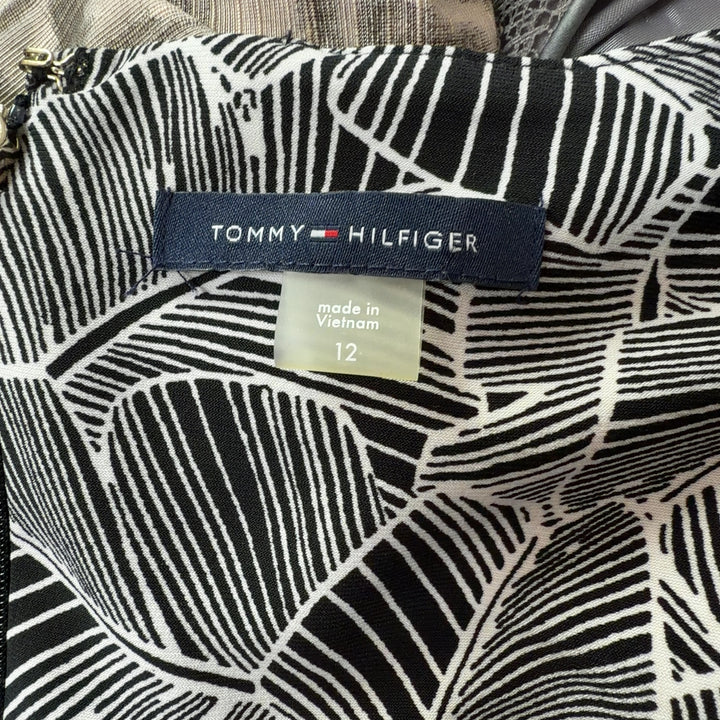 Tommy Hilfiger gray geometric print shift dress with bell sleeves, back view on model