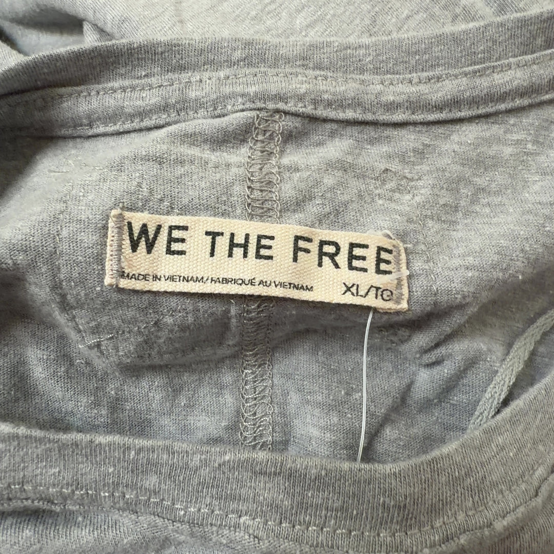 Gray organic cotton short sleeve tee by WE THE FREE, back view on model wearing black leggings
