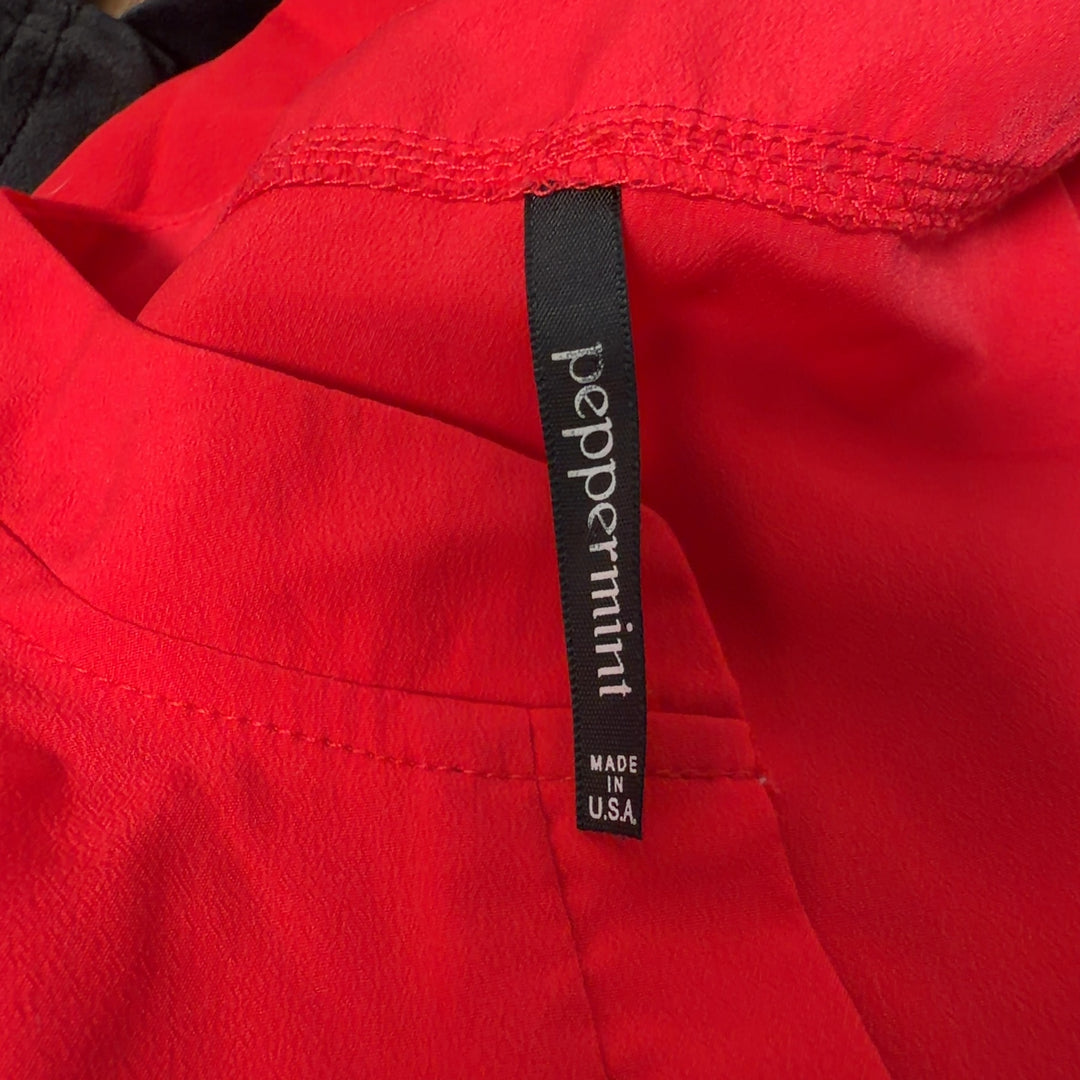 Red hooded polyester dress with drawstring waist and three-quarter sleeves, back view
