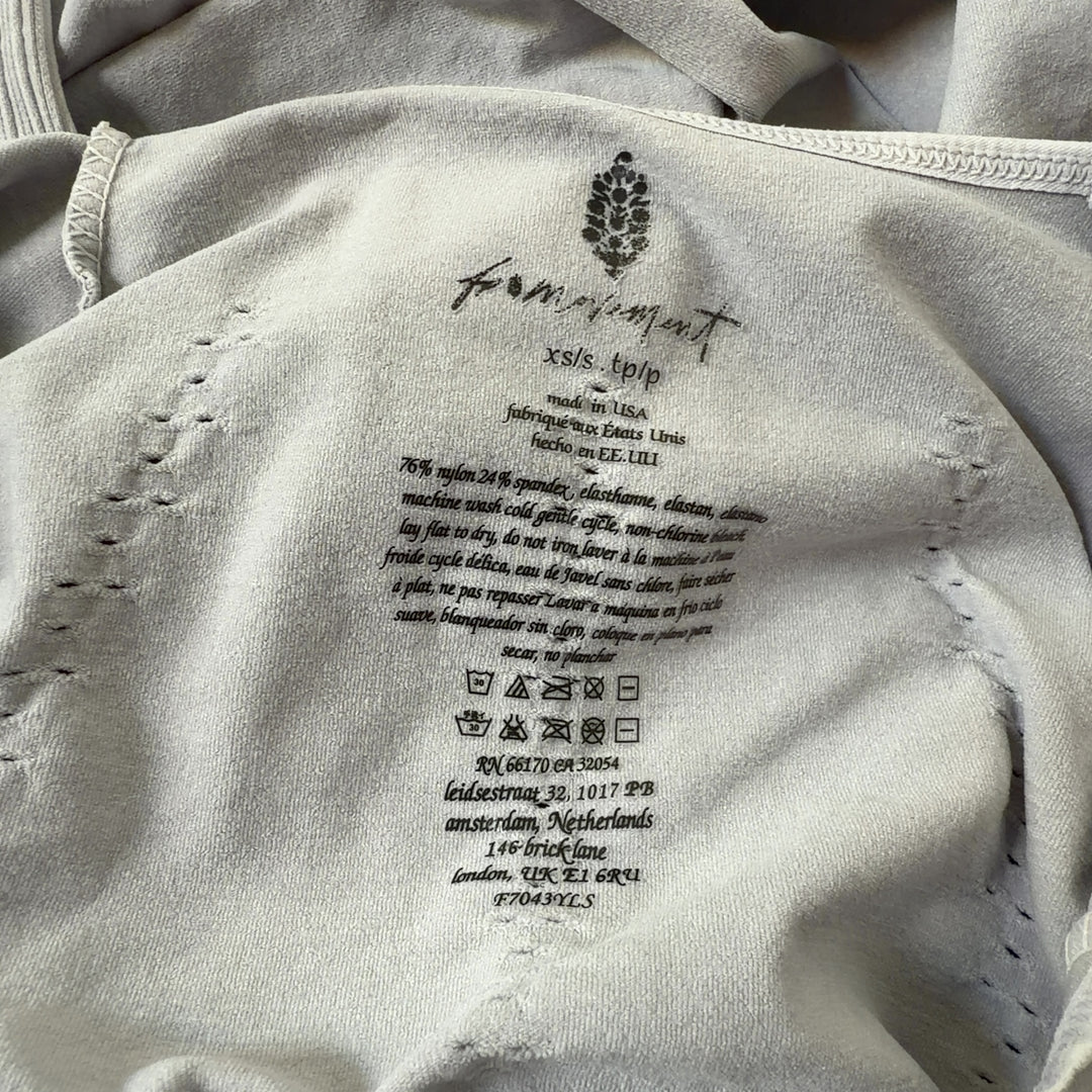 Tag view of cream ribbed all-in-one jumpsuit showing seamless construction and cropped ankle length