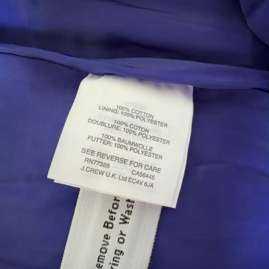 J.Crew blue pencil skirt with frayed hem, back view on model wearing black camisole