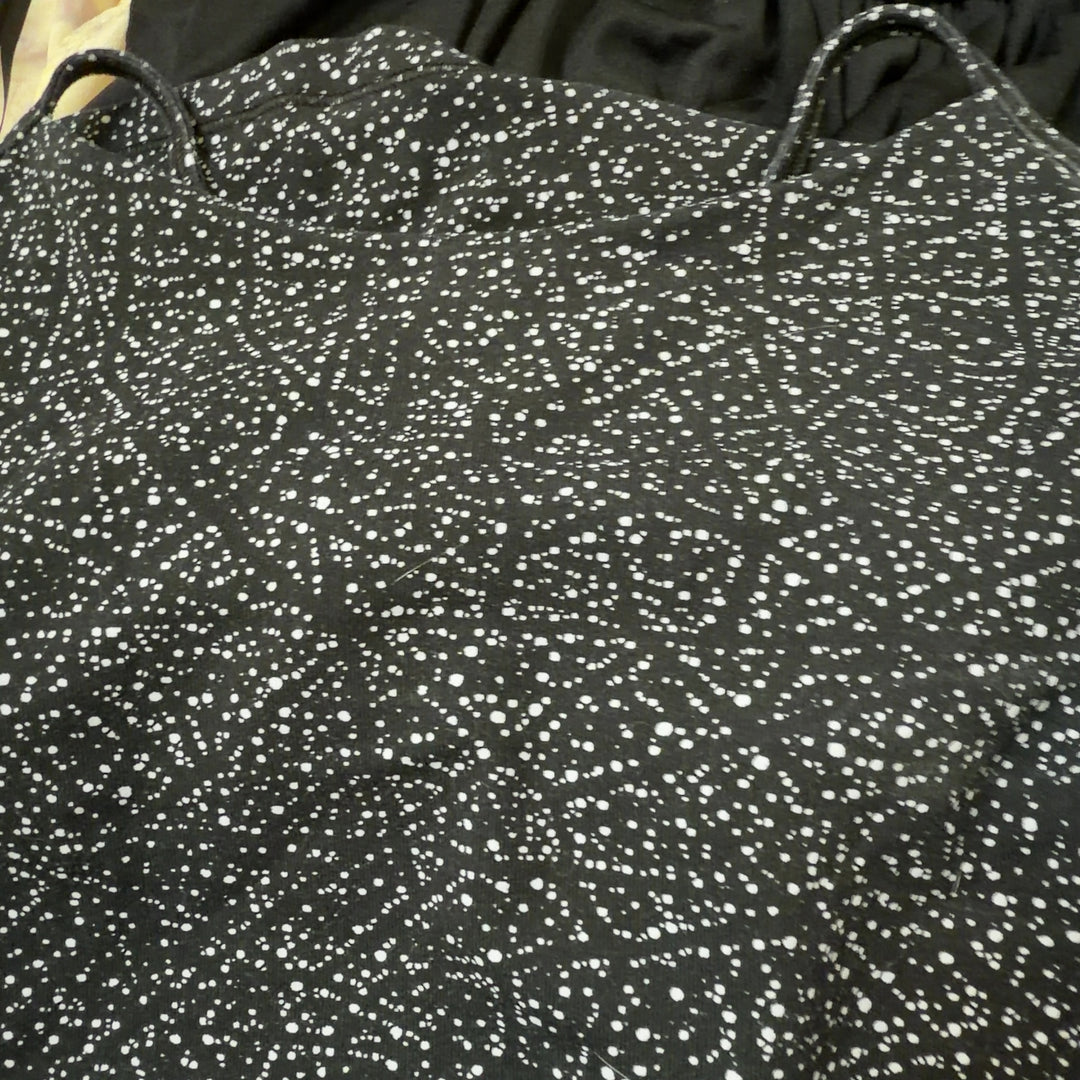 Black speckled Lululemon camisole tank top, back view showing fitted silhouette and strap design