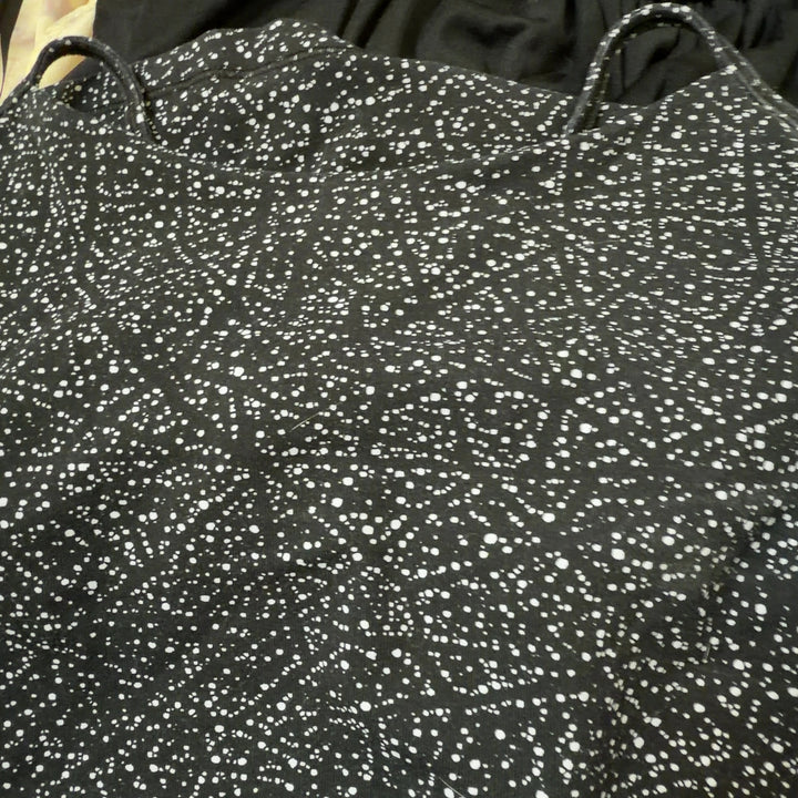 Black speckled Lululemon camisole tank top, back view showing fitted silhouette and strap design