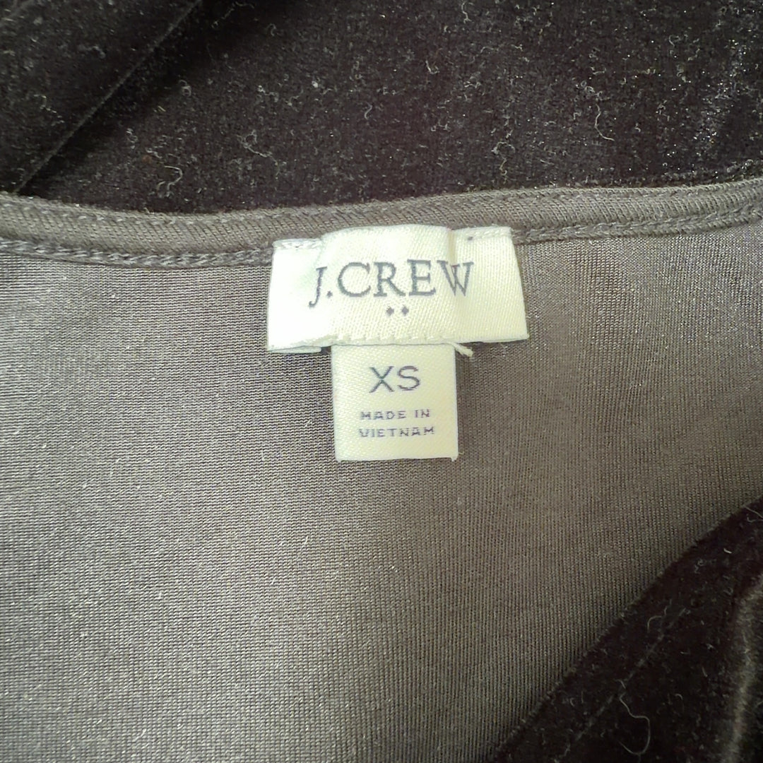 Black velvet sleeveless V-neck top by J.Crew, back view on model