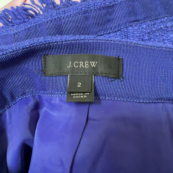 J.Crew blue pencil skirt with frayed hem, back view on model wearing black camisole