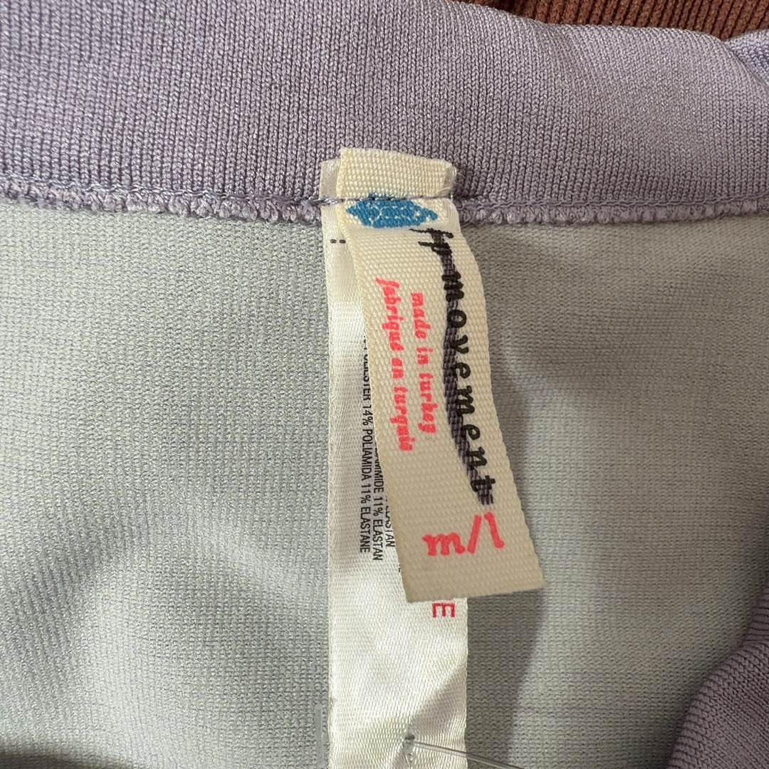 Gray striped crop tank top with cream vertical stripes, back view showing cropped fit