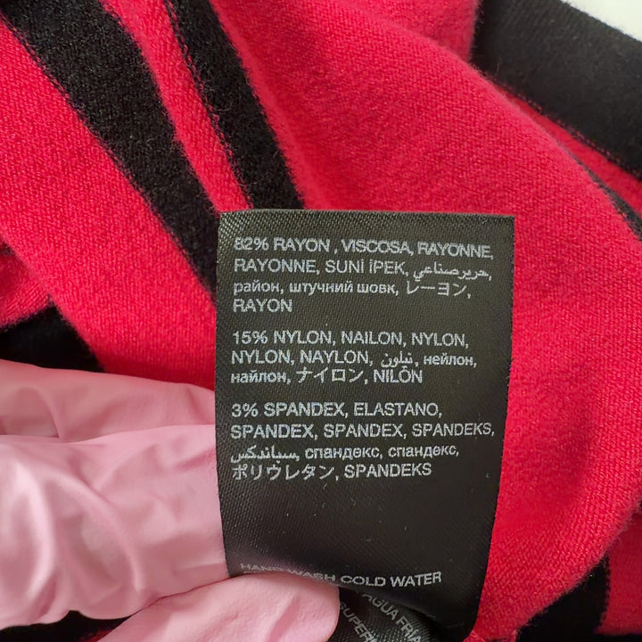 Red and black striped Bebe knit dress with sleeveless design and fitted back view