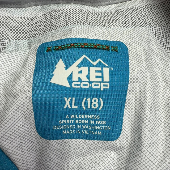 Blue and teal colorblock nylon windbreaker jacket back view showing colorblock design and relaxed fit