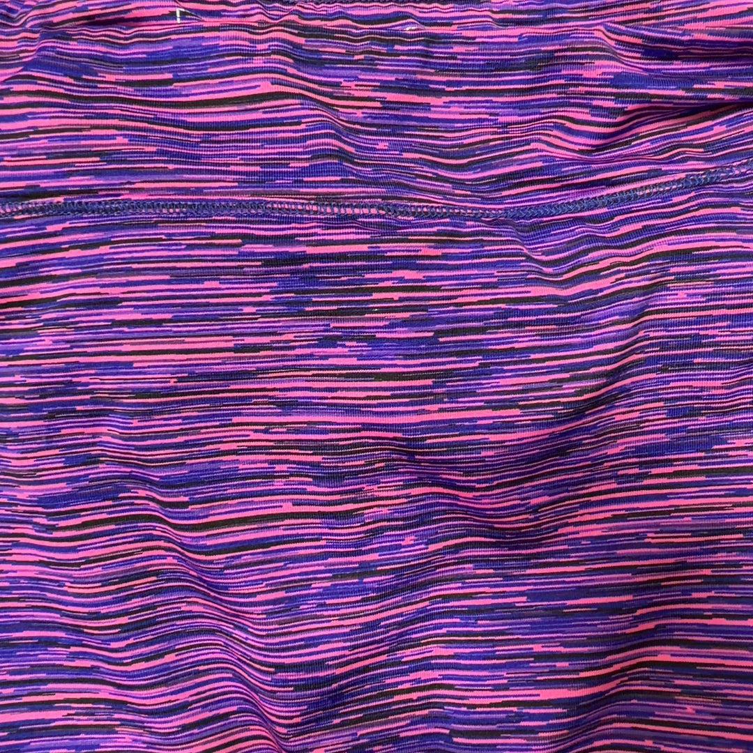 Tag view of purple striped activewear skirt showing A-line silhouette and comfortable fit