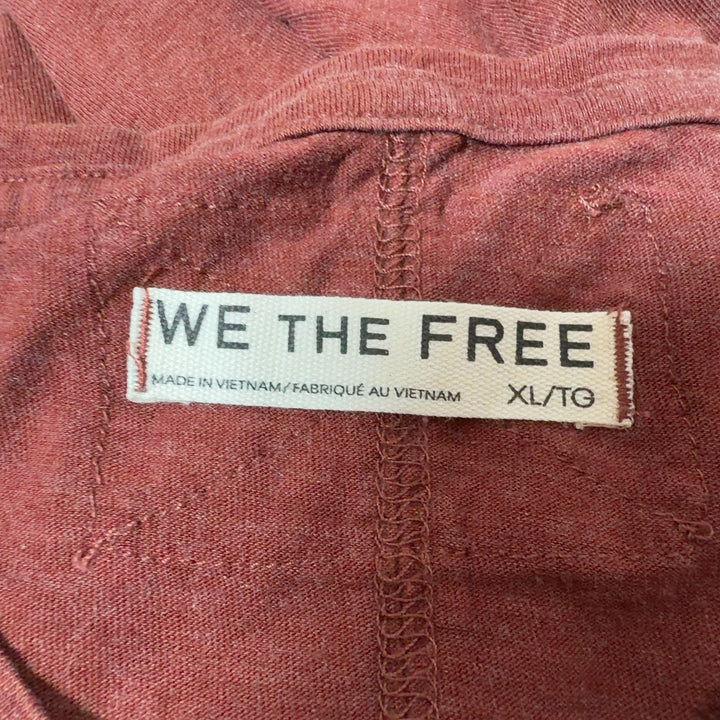 Rust organic cotton short sleeve tee by WE THE FREE, back view showing relaxed fit and distressed sleeve edges