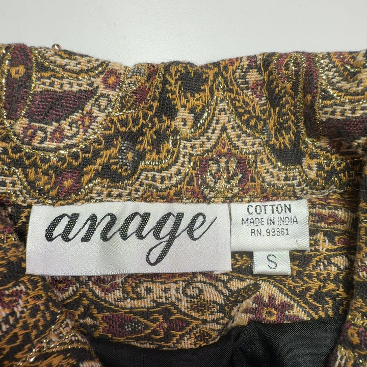 Gold paisley cotton button-up shirt with long sleeves and cropped fit, back view