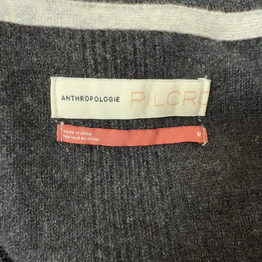 Charcoal cashmere button-front cardigan with pockets, back view showing relaxed fit and longer length