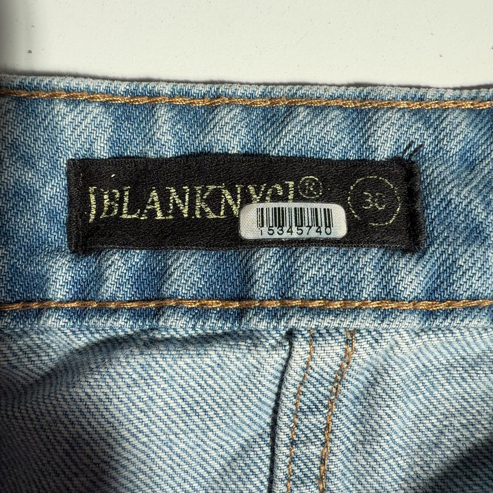 BLANKNYC light wash cargo denim jeans with functional pockets, side view on model