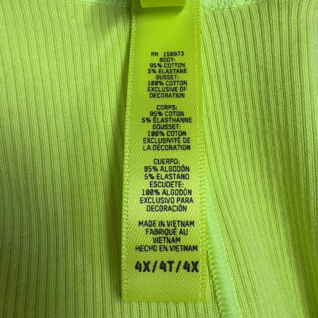 Tag view of neon yellow high-waisted stretch pants from Skims showing fitted silhouette