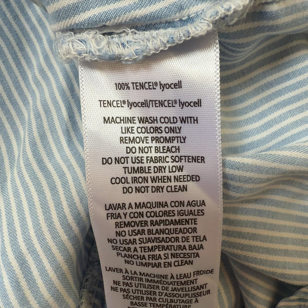 Light blue and white striped Calvin Klein Jeans button-up shirt, back view showing relaxed fit