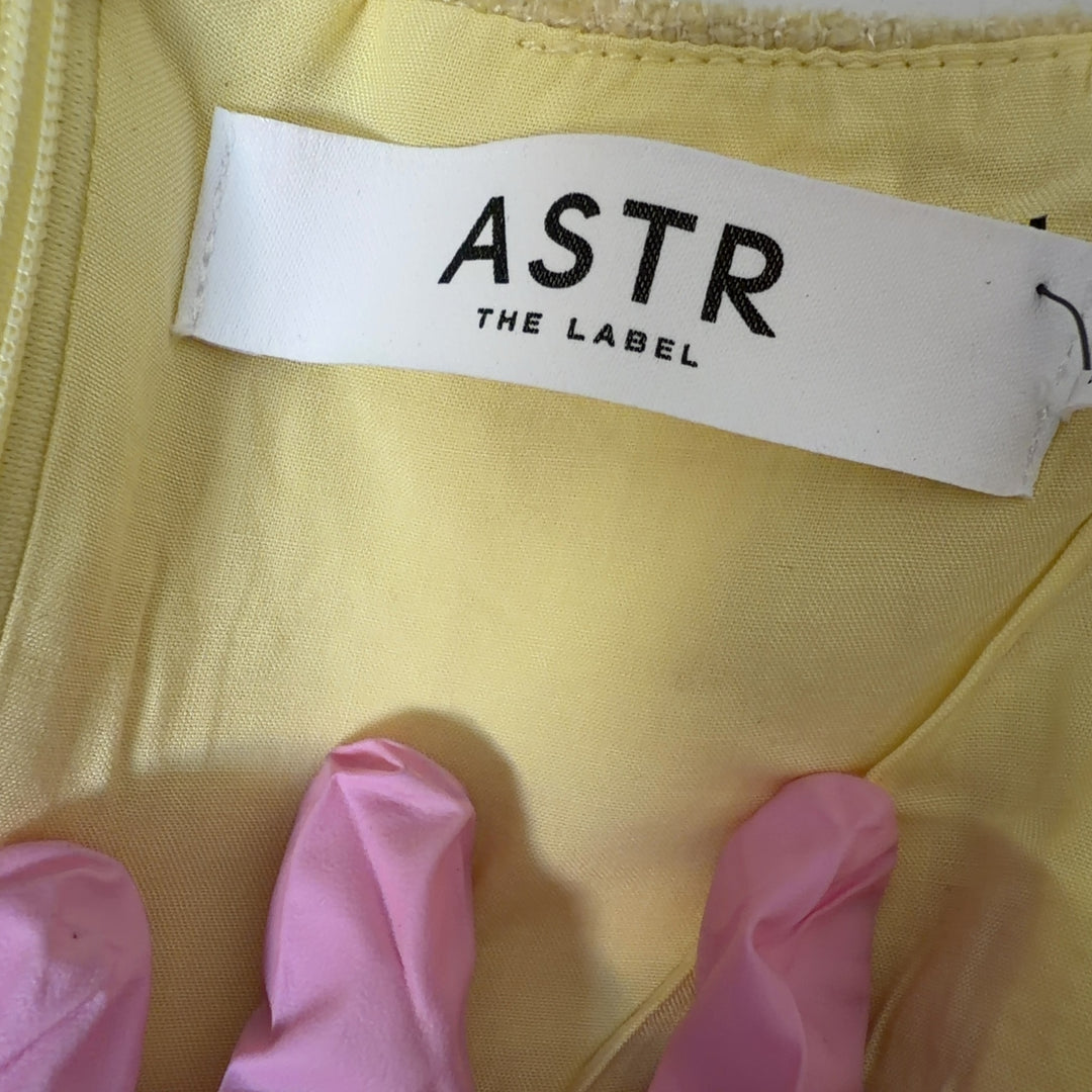 Yellow square neck sleeveless dress with patch pockets, back view
