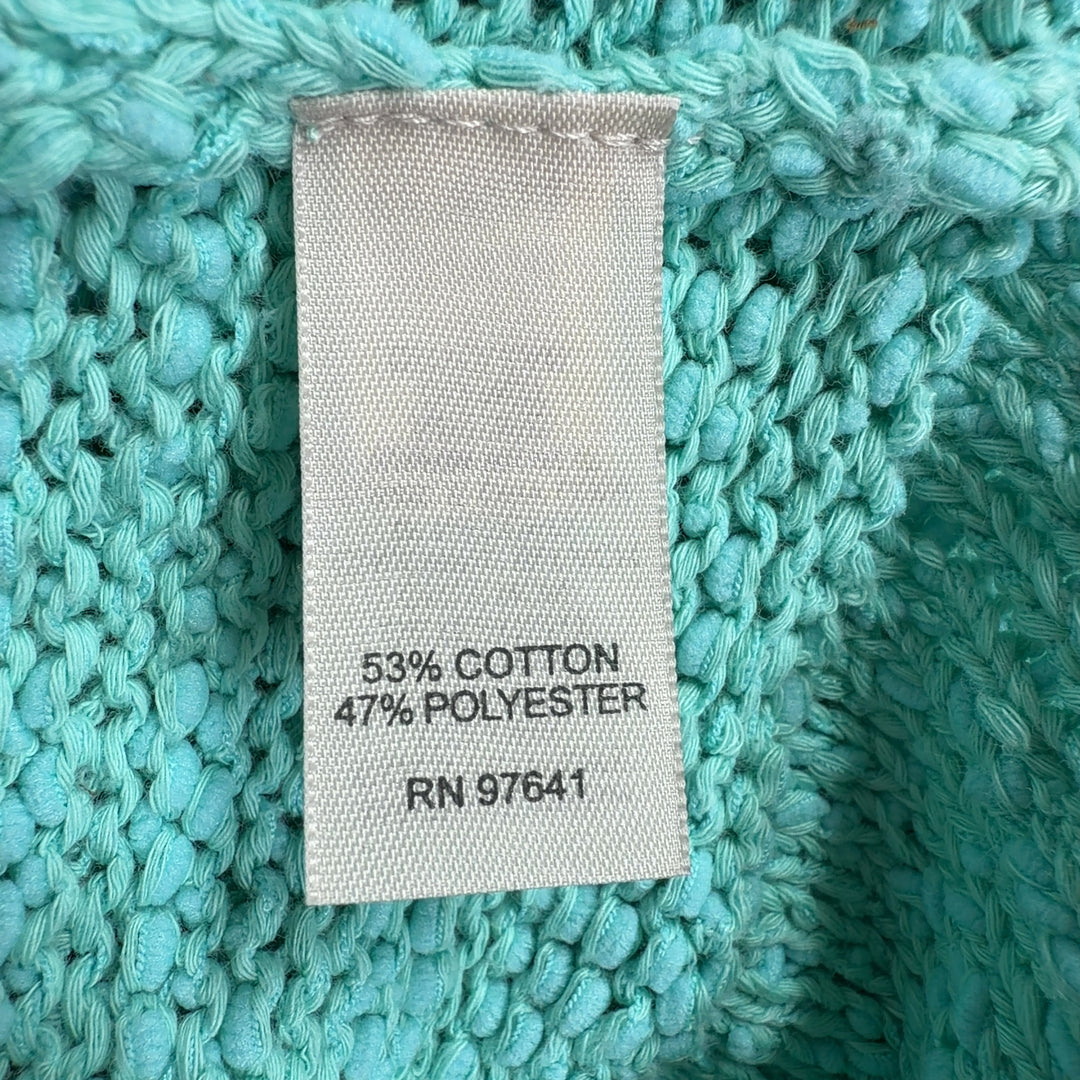 Tag view of mint green hooded knit sweater showing relaxed silhouette and rolled cuffs