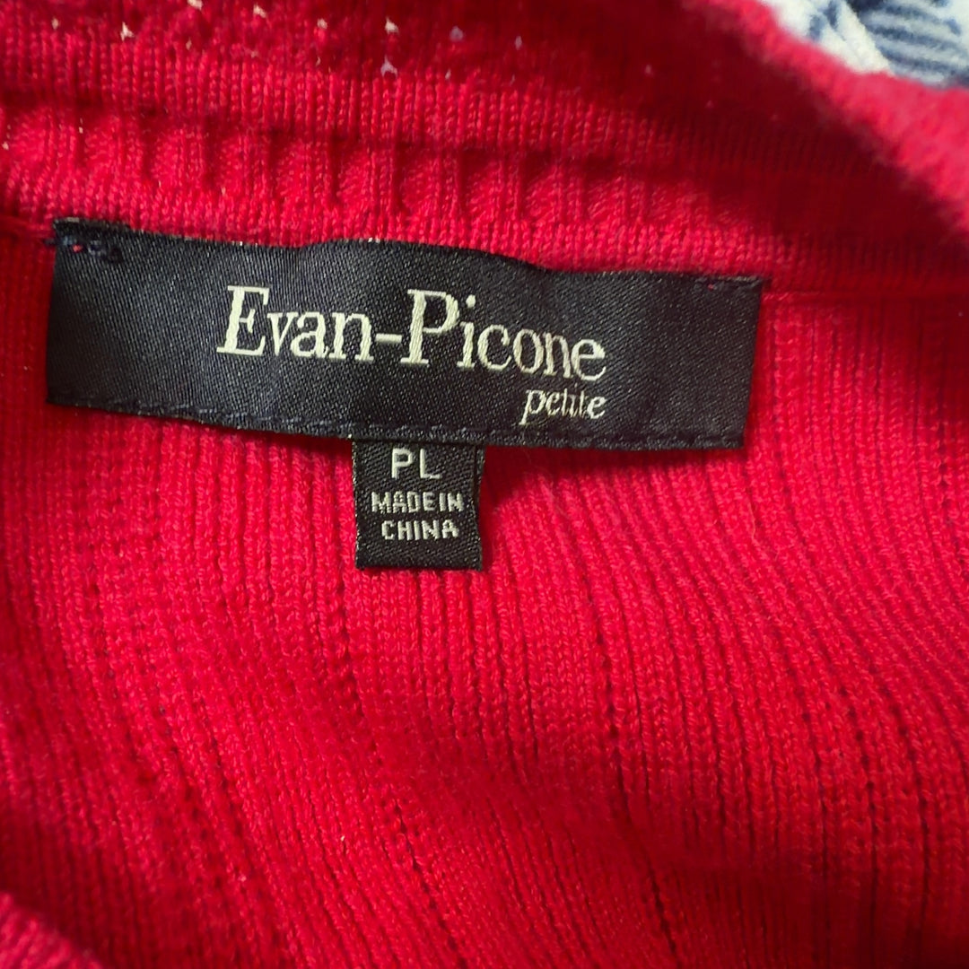 Tag view of red ribbed knit cardigan showing relaxed fit and drape, paired with black leggings and gold heels