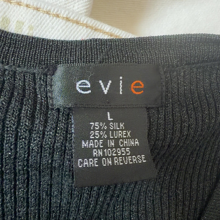 Tag view of charcoal silk lurex cardigan showing cropped silhouette and ribbed cuffs