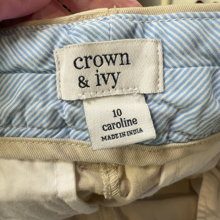Tag view of cream tailored shorts showing flattering fit and classic silhouette