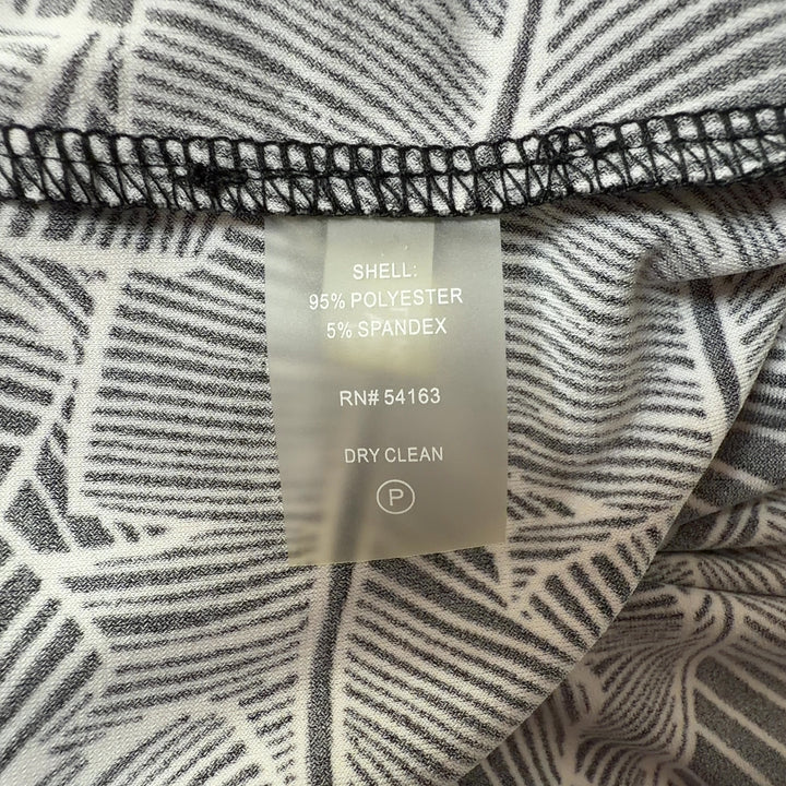 Tommy Hilfiger gray geometric print shift dress with bell sleeves, back view on model