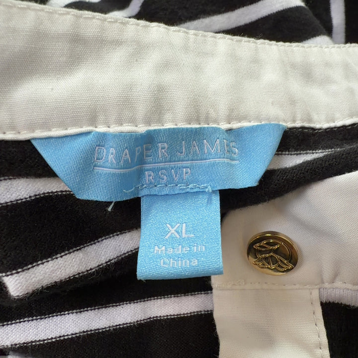 Black and white striped cotton dress back view showing relaxed A-line silhouette and sleeveless design