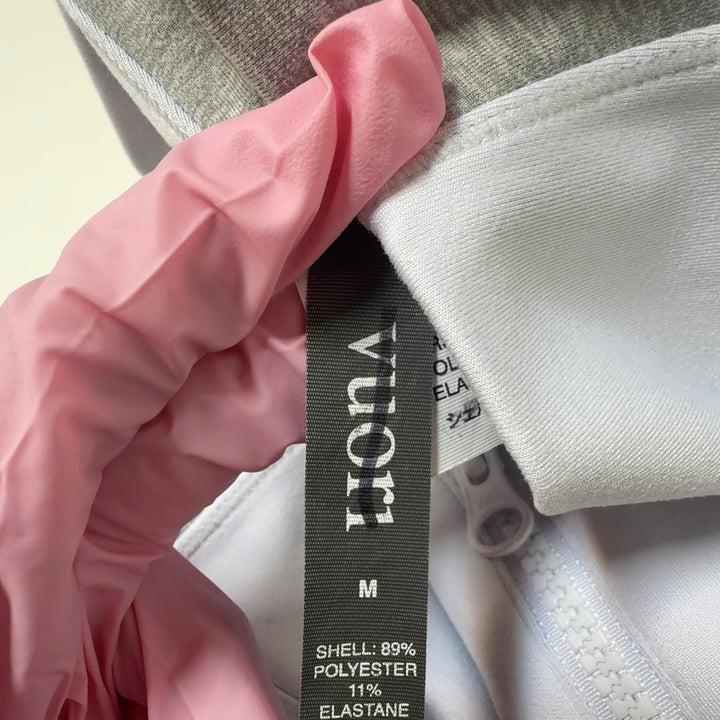 White high-waist leggings with gray side paneling, back view showing fitted silhouette