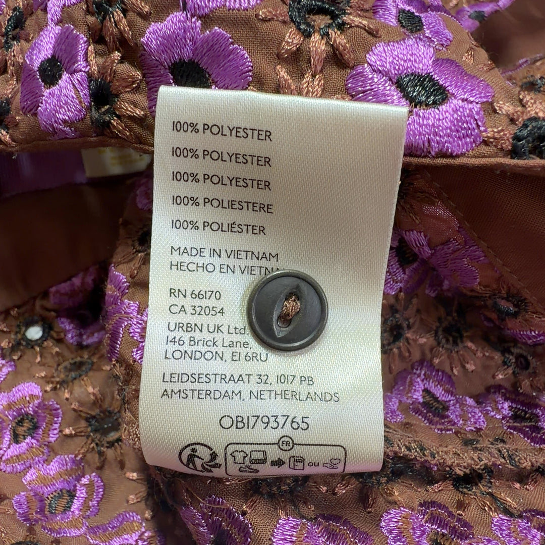 Purple floral print sleeveless collared top by Maeve with button-front design, back view