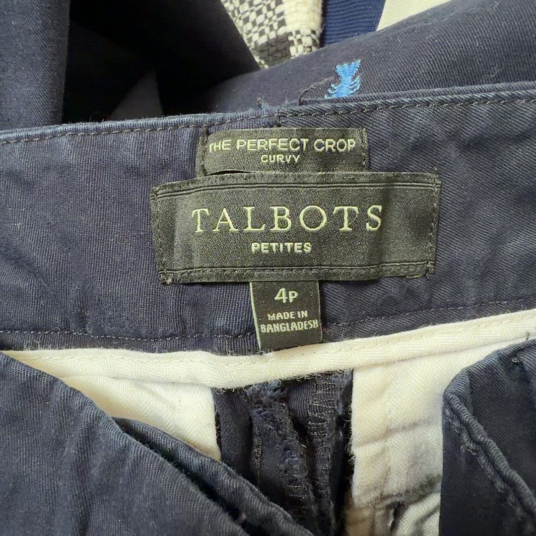 Navy embroidered capri pants with cropped silhouette, back view on model wearing black top