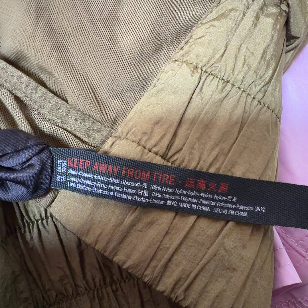 Olive bubble shorts with voluminous silhouette, back view on model wearing black crop top