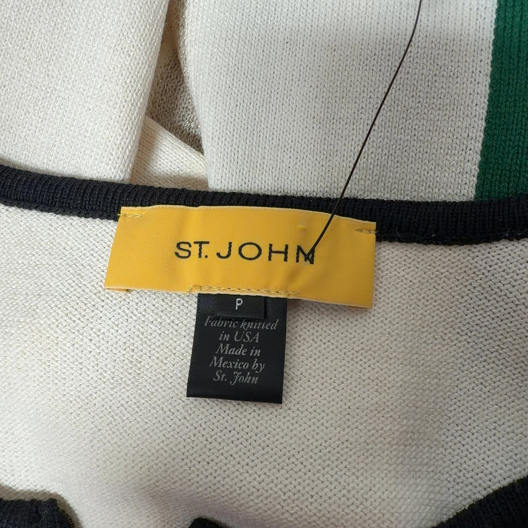 Tag view of geometric knit cardigan showing color-block pattern in green, cream, and black with three-quarter sleeves