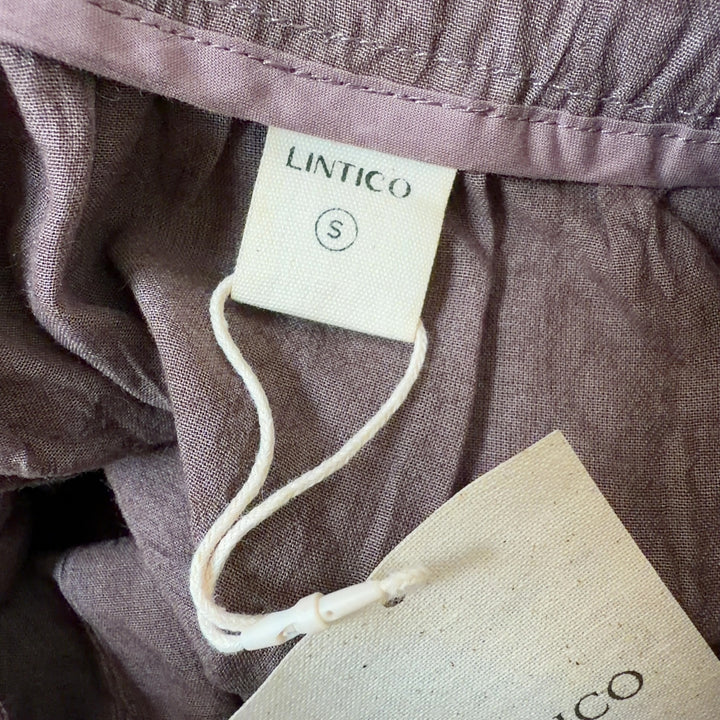 LINTICO brown maxi skirt back view showing flowing fabric and relaxed fit