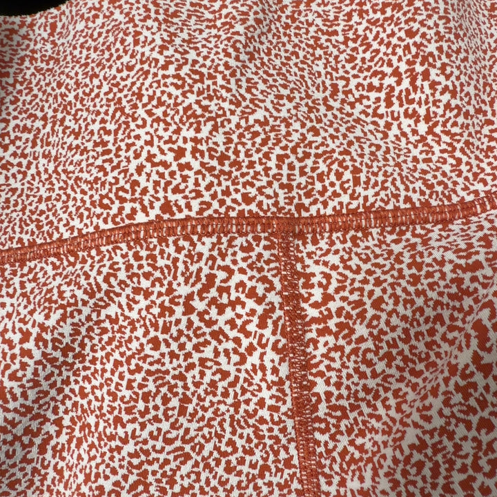 Athleta coral speckled high-waist capri leggings back view on model