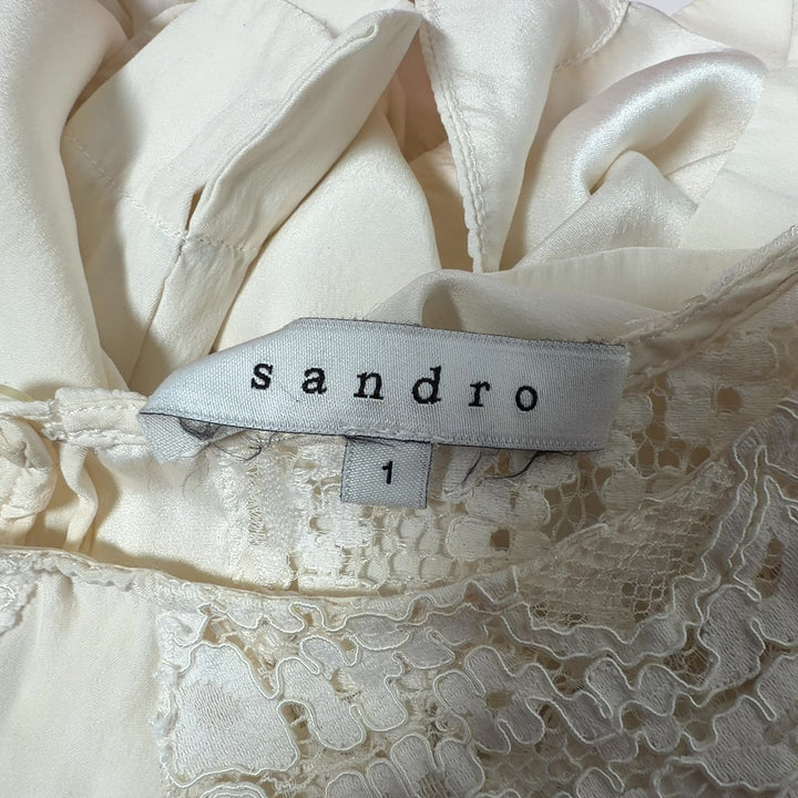 Cream Sandro blouse with lace neckline detail, back view on model