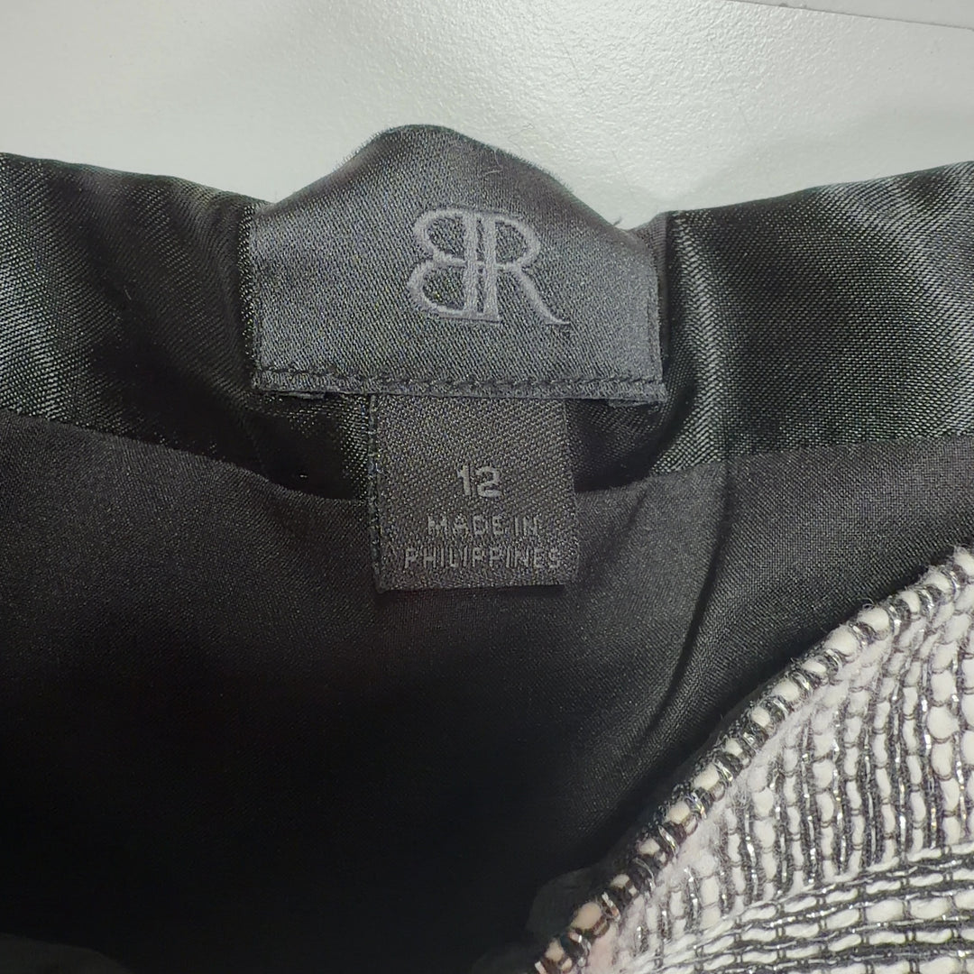 Silver metallic knit mini A-line skirt with shimmering finish, back view on model