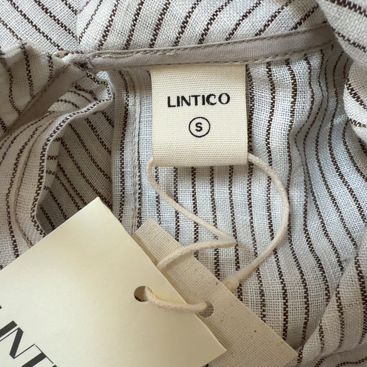 Cream linen ribbed sleeveless tank top with asymmetrical hemline, back view