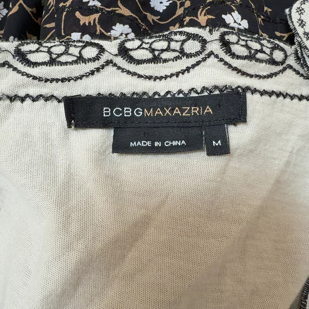 Tag view of cream embroidered cotton top showing empire waist and scalloped hem detail