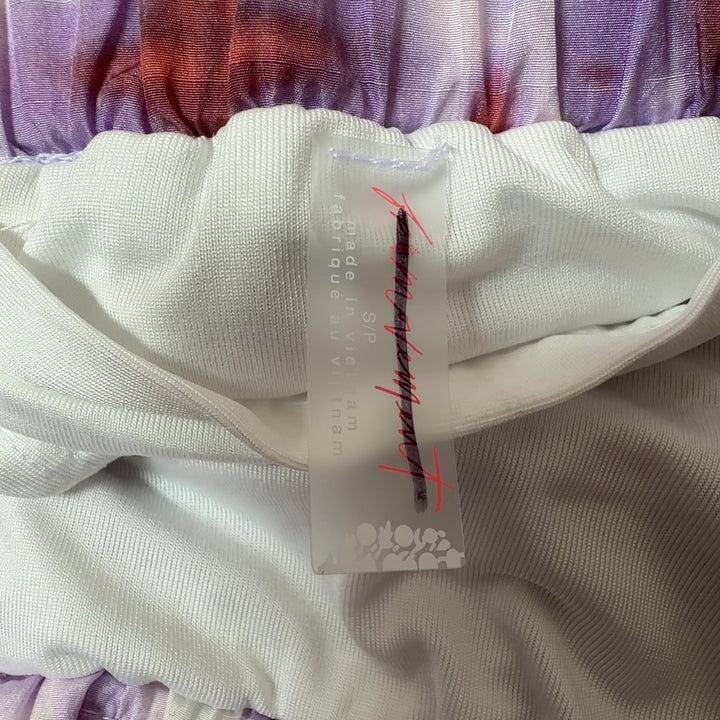 Tag view of pink tie dye athletic shorts with burgundy trim and side pockets by Free People Movement