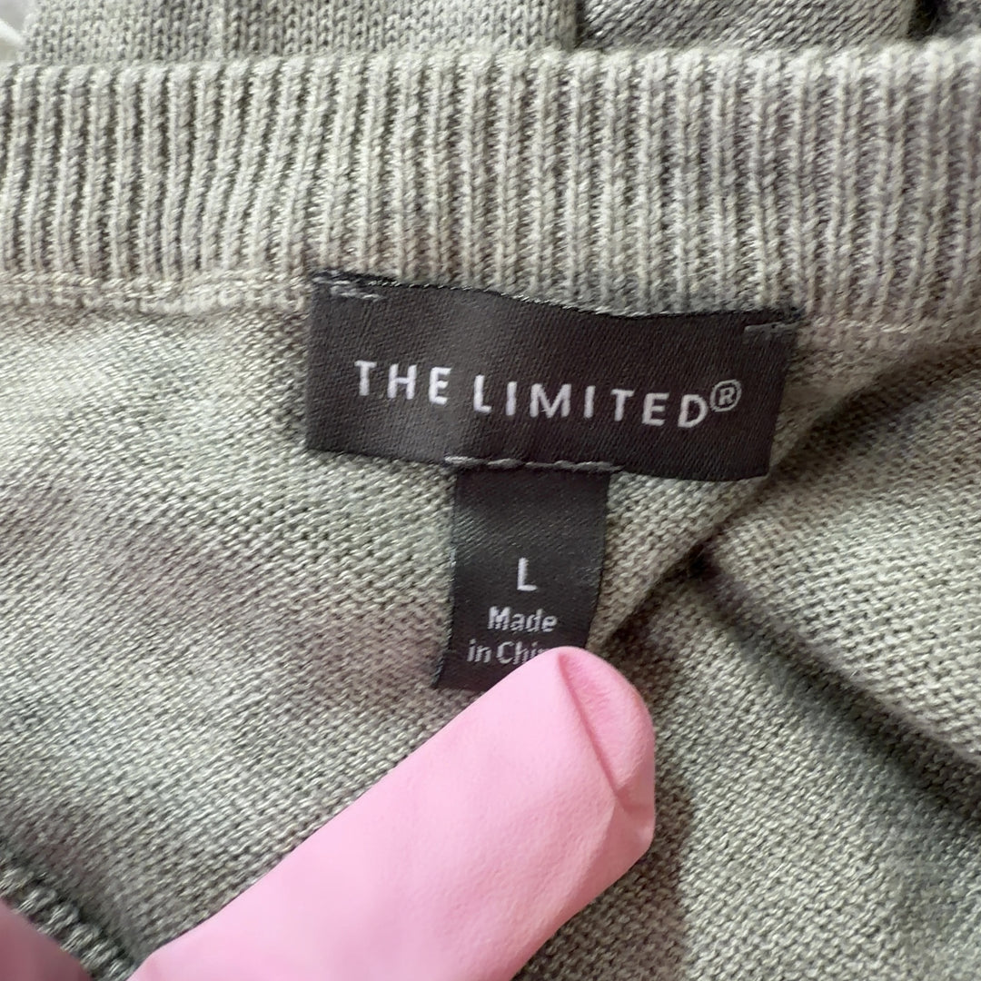 Tag view of beige knit pullover sweater showing clean silhouette and relaxed fit