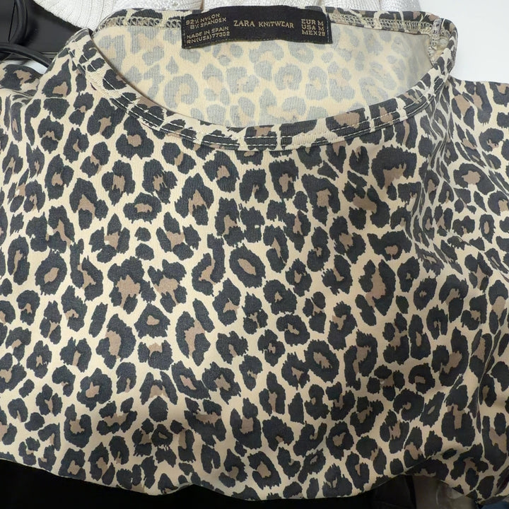 Beige leopard print short-sleeve fitted top by Zara Knit, back view on model