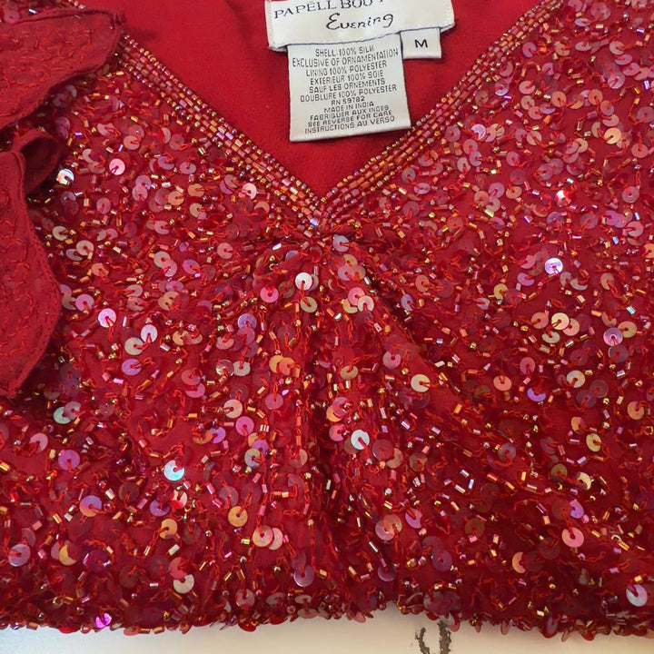 Red sequin cold shoulder top with flutter sleeves by Papell Boutique, back view