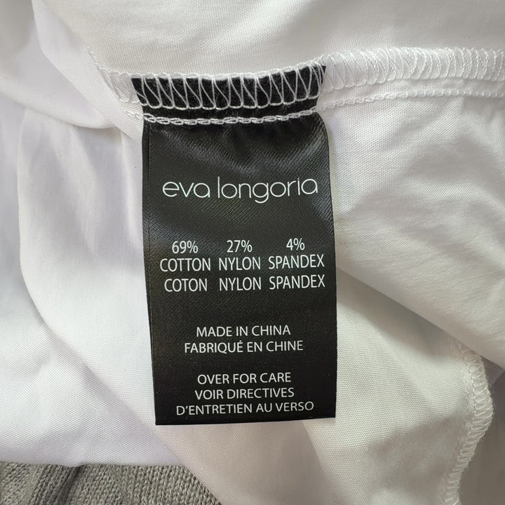White button-up collared shirt back view, showing relaxed fit and length