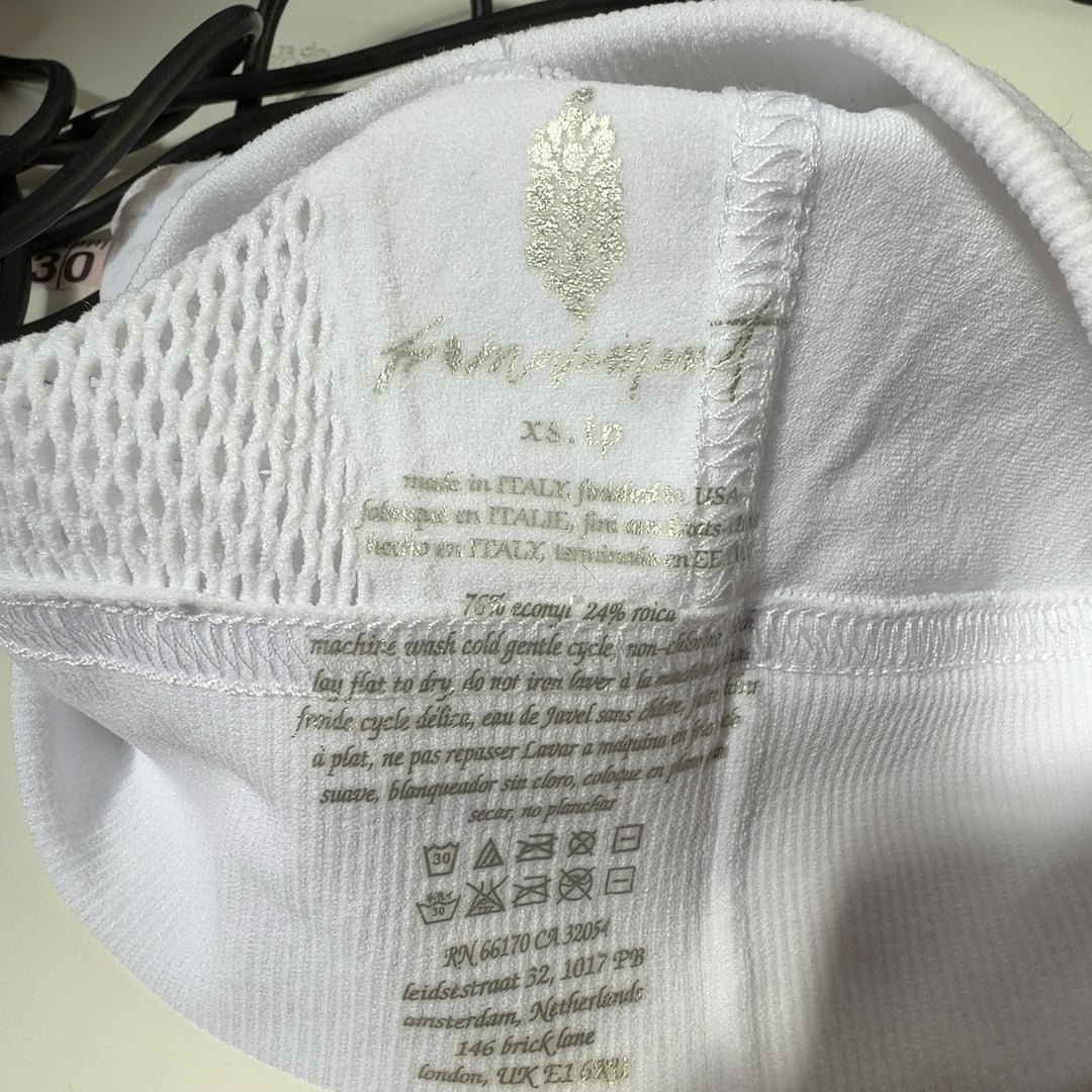 White mesh cutout sports bra with racerback design, back view on model