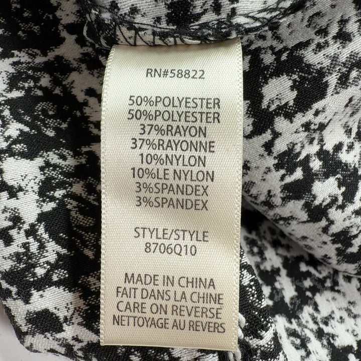Black and white houndstooth tweed pencil skirt back view, showing fitted silhouette by Max Studio