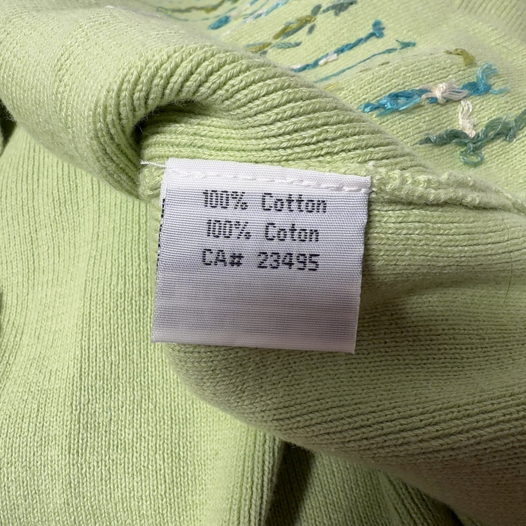 Tag view of lime green embroidered cardigan showing full-zip closure and embroidered hem details