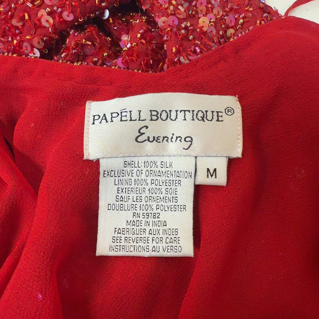 Red sequin cold shoulder top with flutter sleeves by Papell Boutique, back view