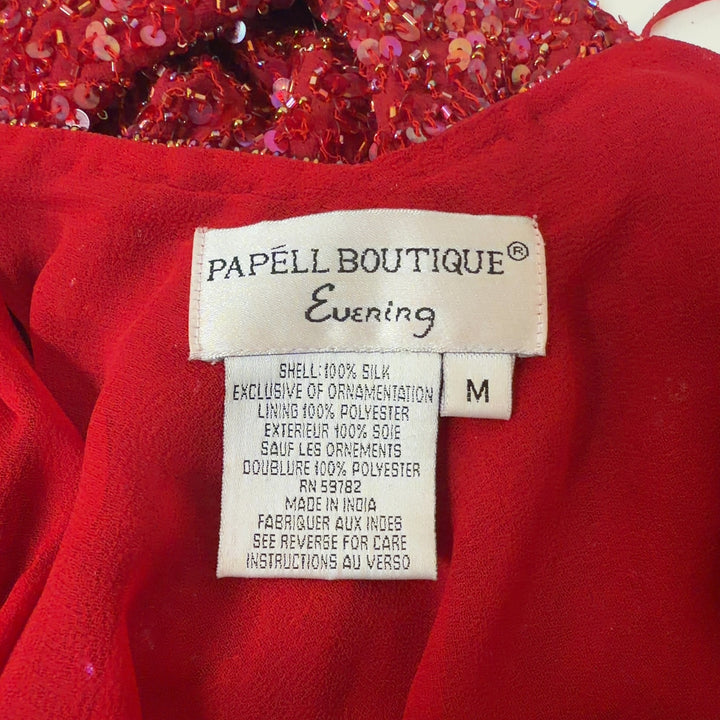 Red sequin cold shoulder top with flutter sleeves by Papell Boutique, back view