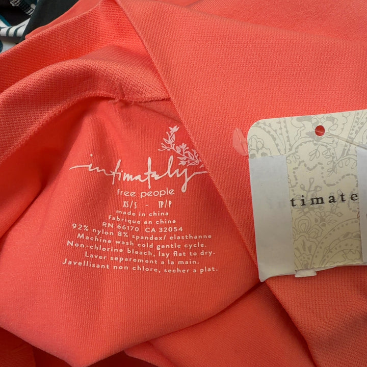 Coral high-waist biker shorts back view, form-fitting athletic shorts