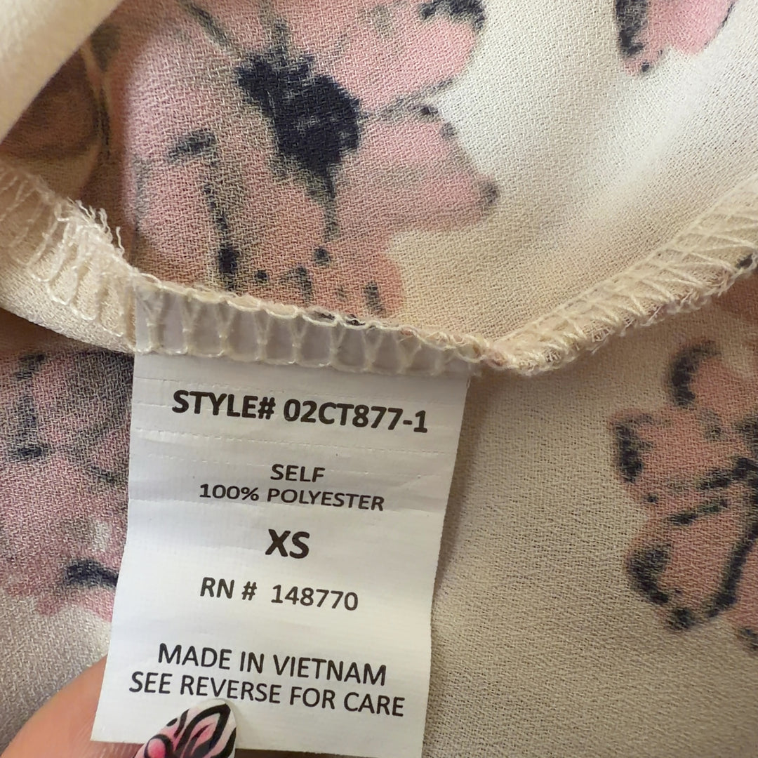 SilkRoll cream floral blouse with pink flowers, back view showing short sleeves and relaxed fit