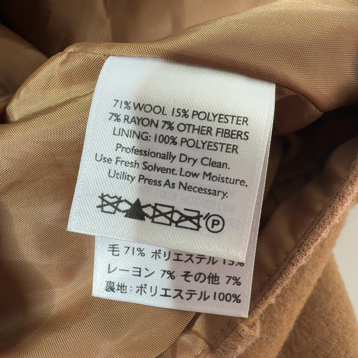 Tan button-front A-line skirt back view showing structured silhouette and button closure